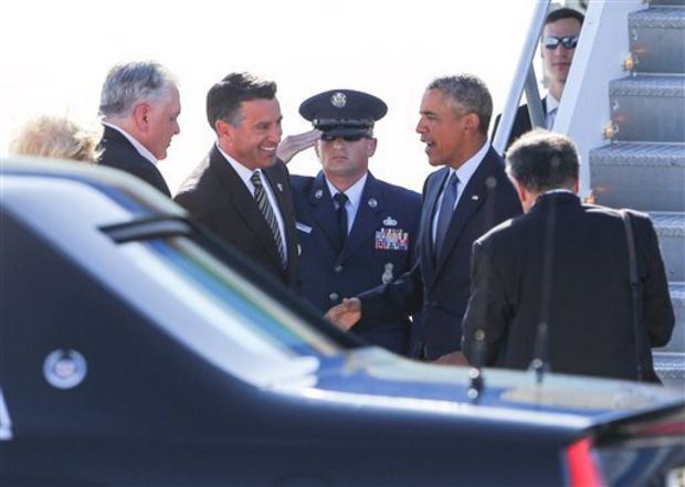 Gov. Sandoval welcomes and greets Pres. Obama when the latter arrives in Las Vegas. (Source: Associated Press)