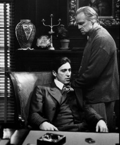 A scene from the Mafia film "The Godfather" featuring Al Pacino (left) as Michael Corleone and Marlon Brando as Vito Corleone. (Paramount Pictures / Wikipedia)