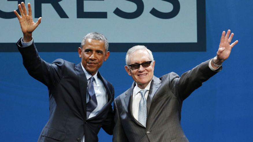 Obama and Reid (Photo by John Locher, Associated Press).