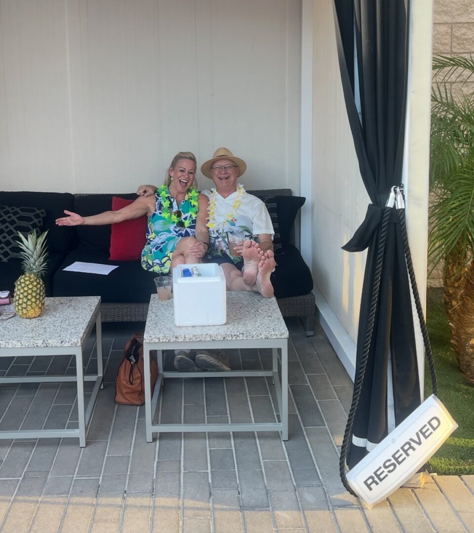 Sherry Rickard and Chuck Muth enjoy Bobby Khan's cabana